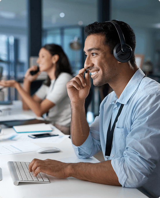 Man and woman wearing headsets, providing customer service.