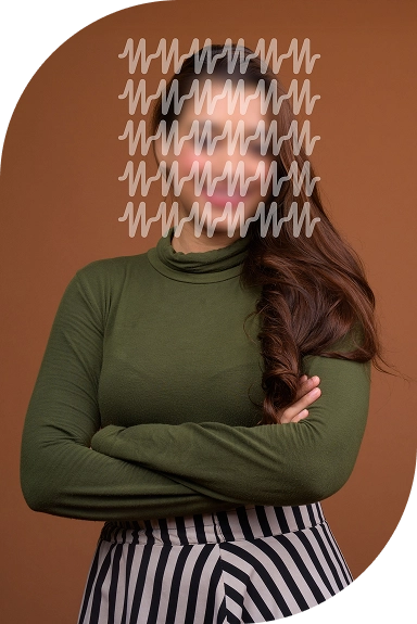 A woman standing with her arms crossed.