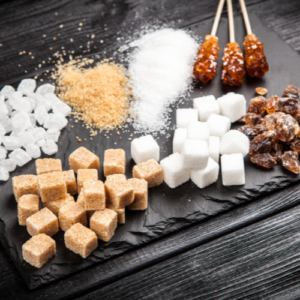 Various types of sugar, including cubes and raw sugar.